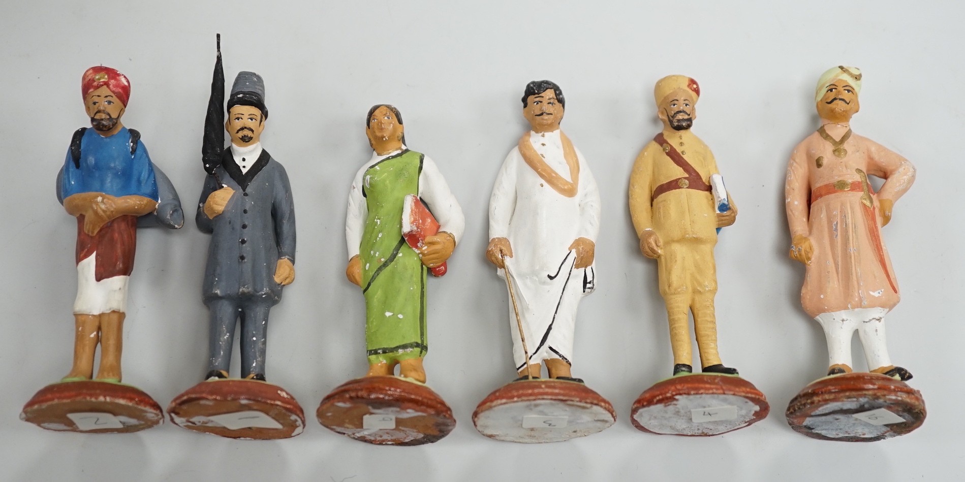 A quantity of Indian painted terracotta figures